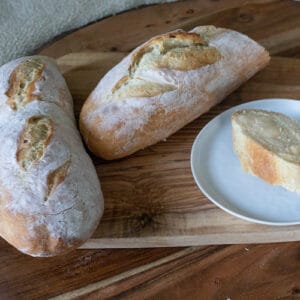 A crusty french baguette with fresh butter