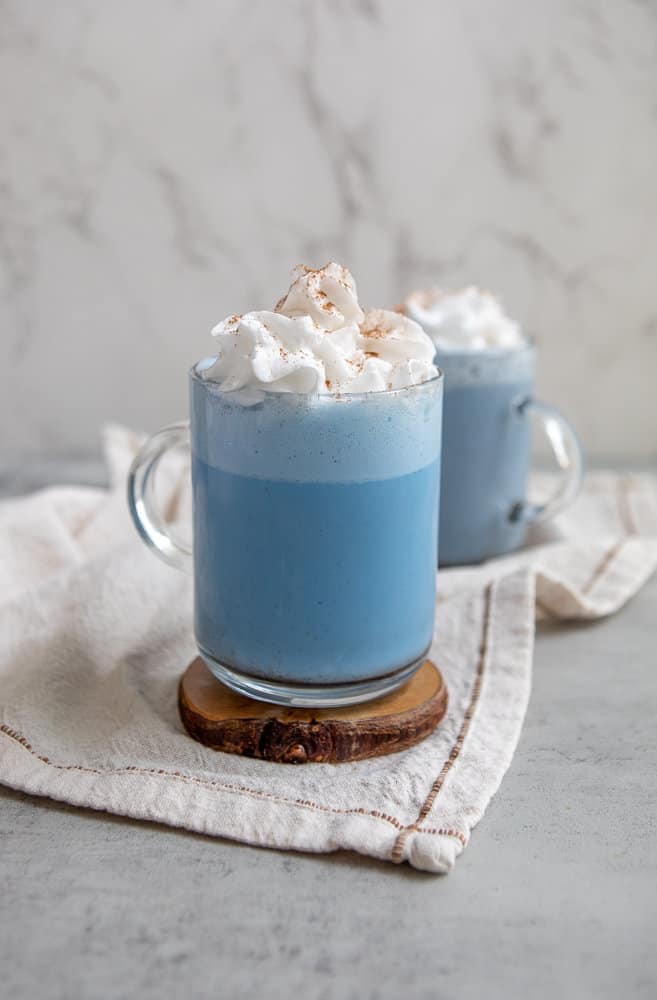 blue latte made with spirulina and topped with whipped cream