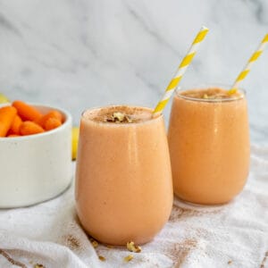 Carrot smoothie with walnuts and cinnamon on top