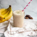 almond butter banana smoothie with straw