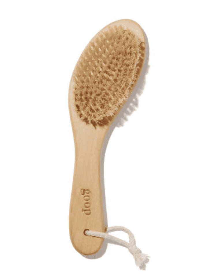 A tan body brush from goop