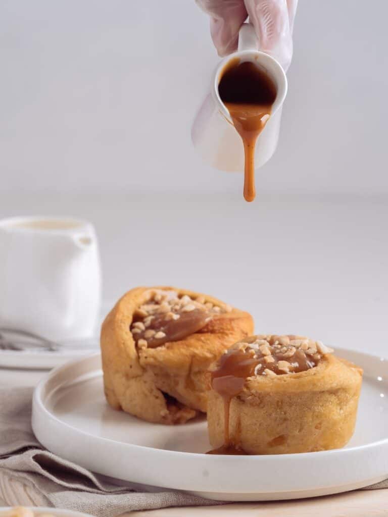 drizzling caramel on top of a baked good