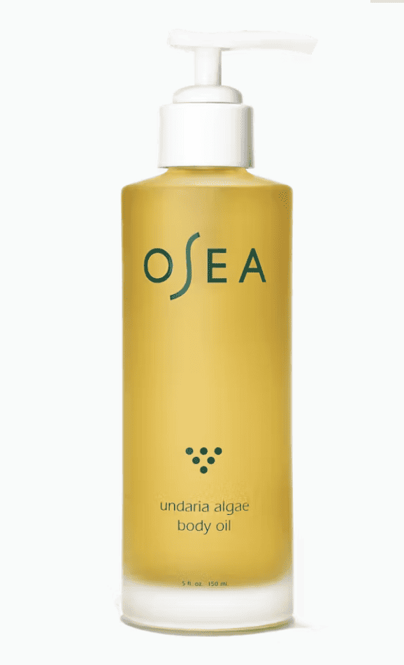 A pump bottle of body oil with green Osea logo