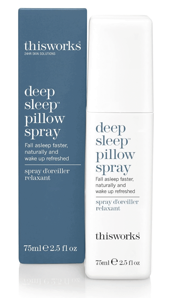 A white spray bottle with blue text saying deep sleep pillow spray next to the blue box it comes in