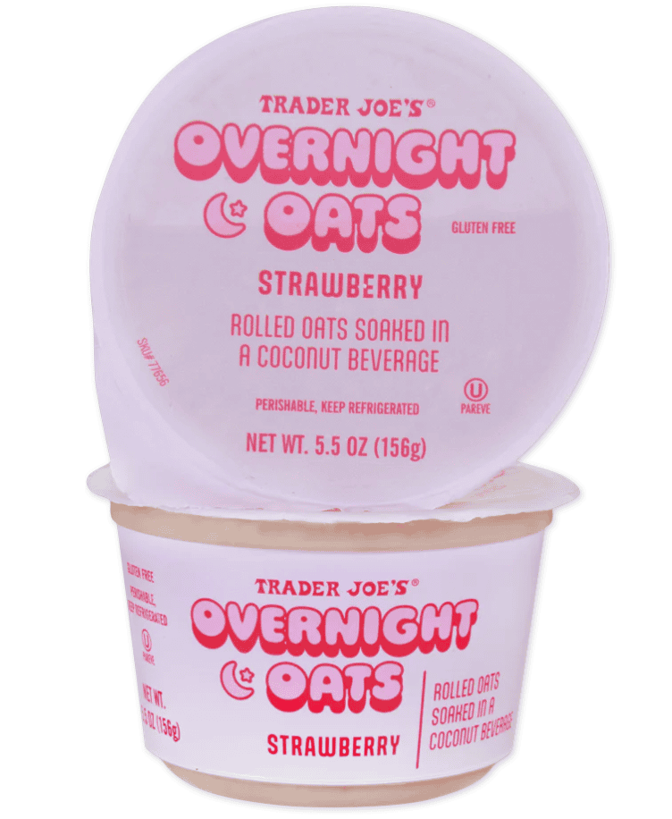A clear container of strawberry overnight oats with a pink lid and label