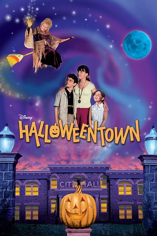 City hall with a pumpkin in front of it and a witch flying through the sky as her family looks on, with the film title, 'halloweentown' in the middle
