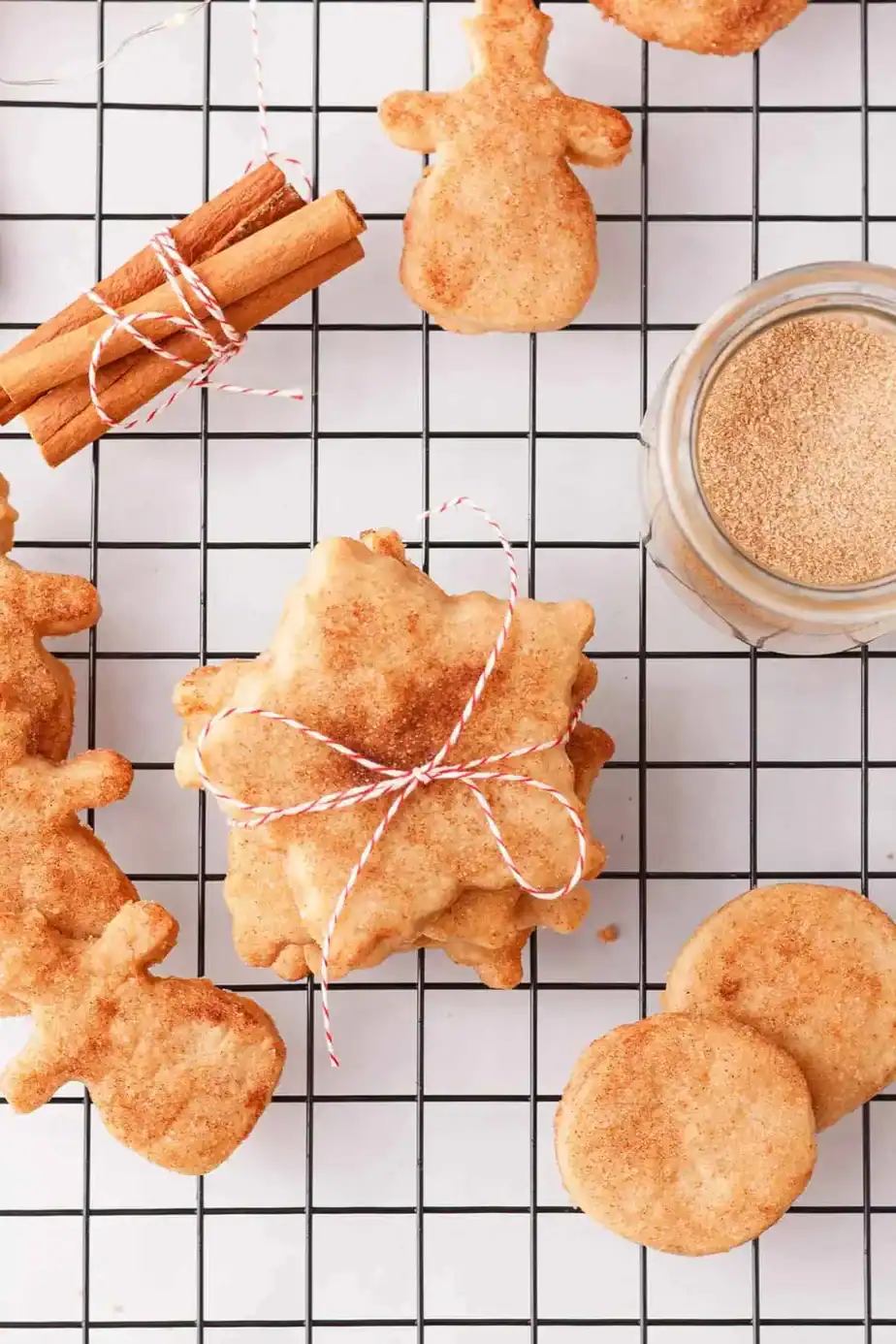 A cooking tray with cinnamon shortbread cookies topped with cinnamon sugar.