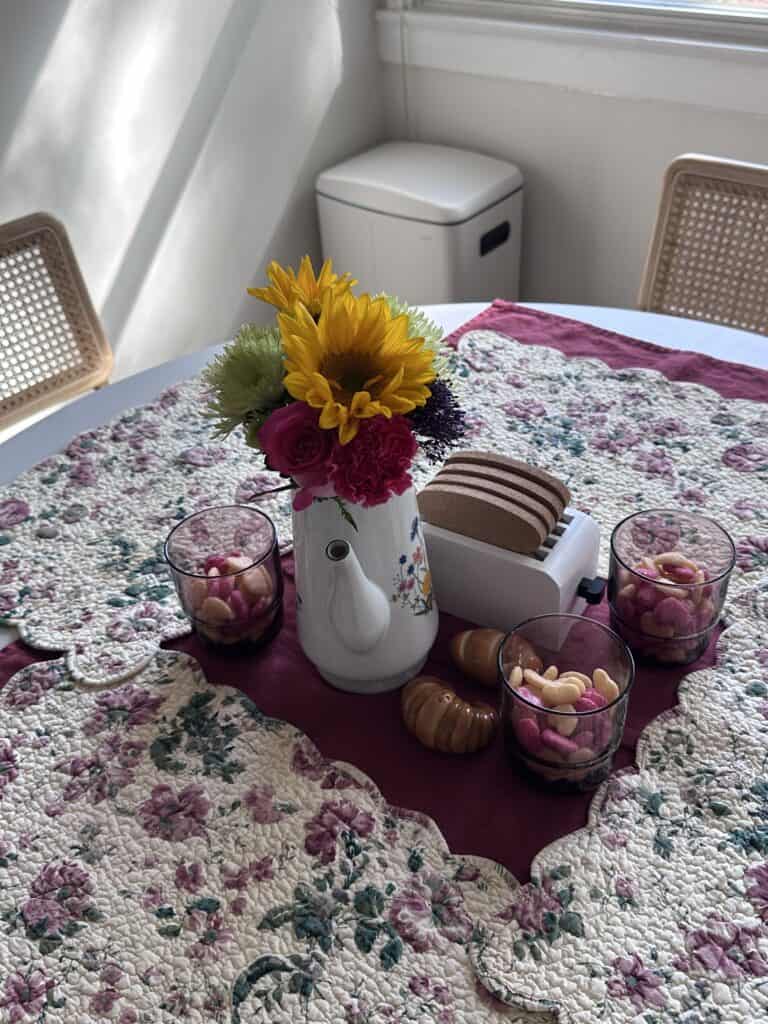 Flowers set up on the table with snacks