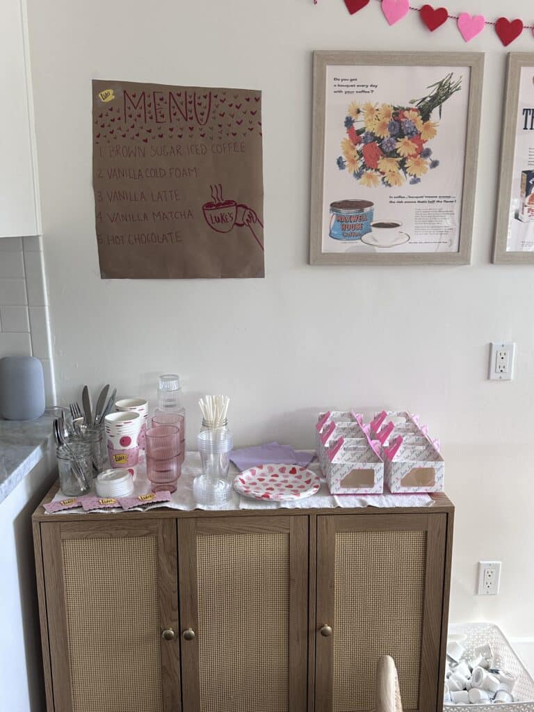 Supplies for the coffee shop on my cabinets with a menu hanging above