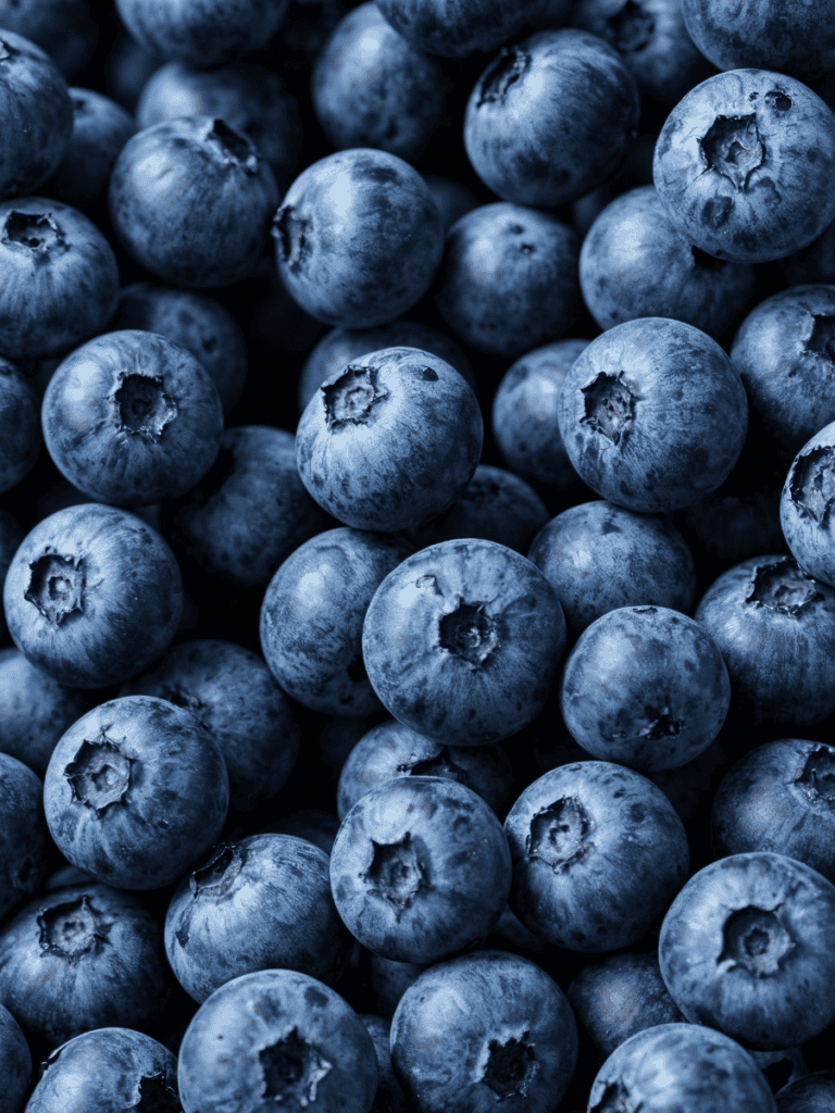An extreme close up of blueberries