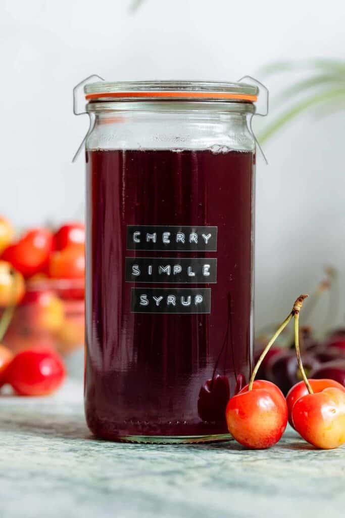 A jar of cherry simple syrup