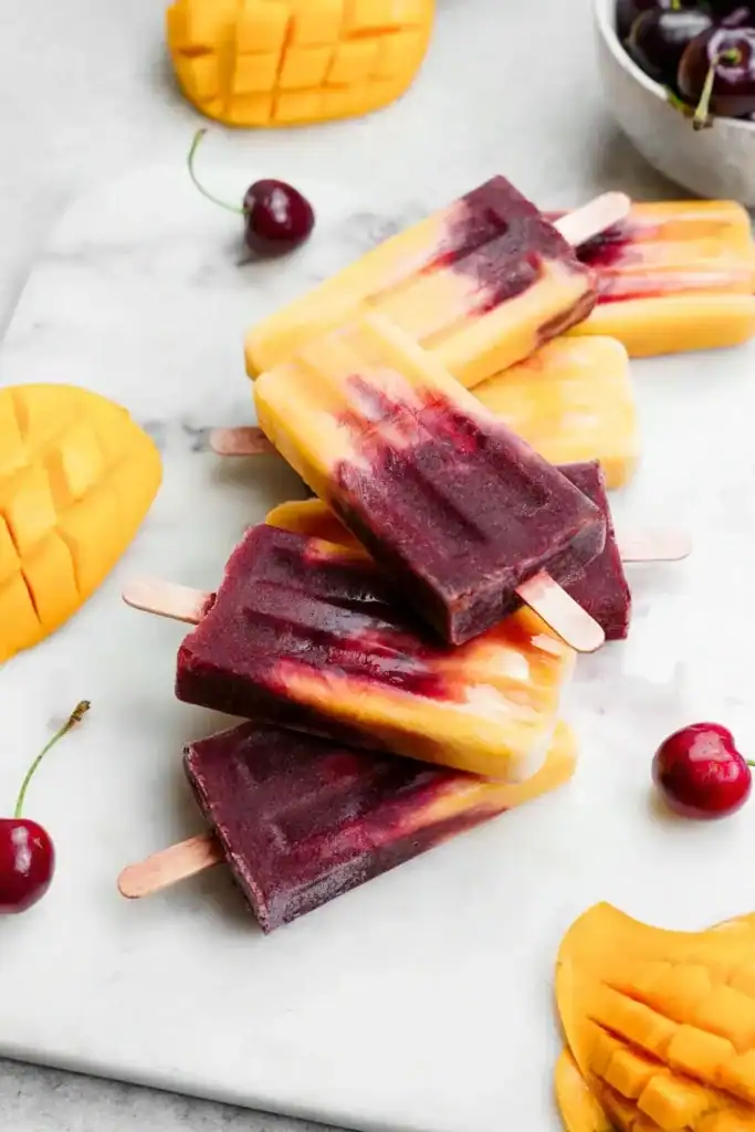 A stack of cherry mango popsicles